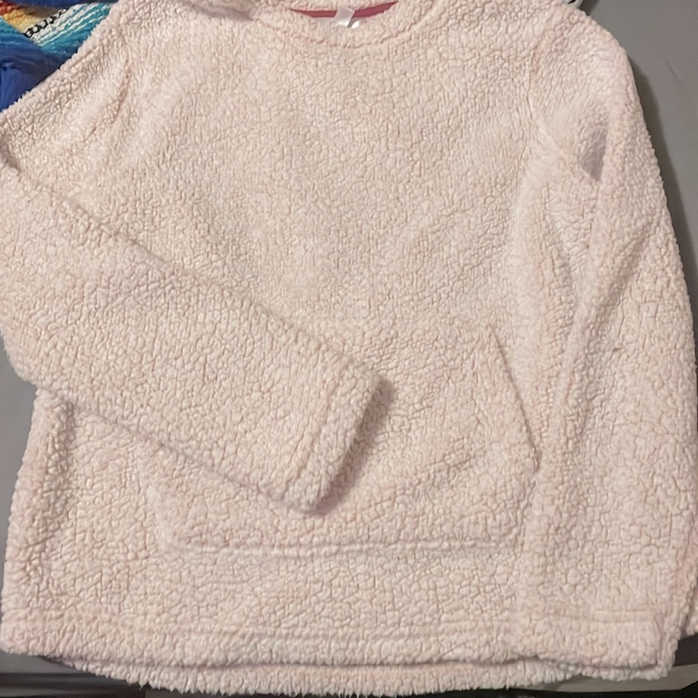 white with pink tint sweater